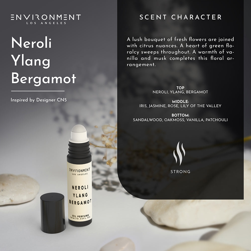 Portable perfume applicator styled in a minimalist vanity scene