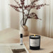 lit Chanel candle on a table 